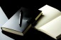 Preview: Notizbuch DIN A5 gebunden mit Verschlusslasche, CAMBRIDGE Top Grain Rindspaltleder schwarz