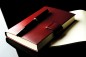 Preview: Notizbuch DIN A6 gebunden mit Verschlusslasche, CAMBRIDGE Top Grain Rindspaltleder rot